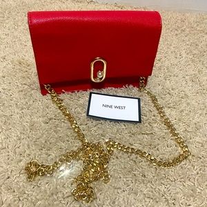 Red crossbody bag gold chain